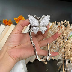 Novuxy® Elegant Foldable Butterfly Bag Hook for Women - Sparkling Metal Handbag Hanger, Portable Space-Saving Wall & Desktop Organizer