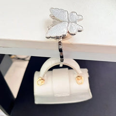 Novuxy® Elegant Foldable Butterfly Bag Hook for Women - Sparkling Metal Handbag Hanger, Portable Space-Saving Wall & Desktop Organizer